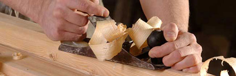 Carpenter Planing Wood